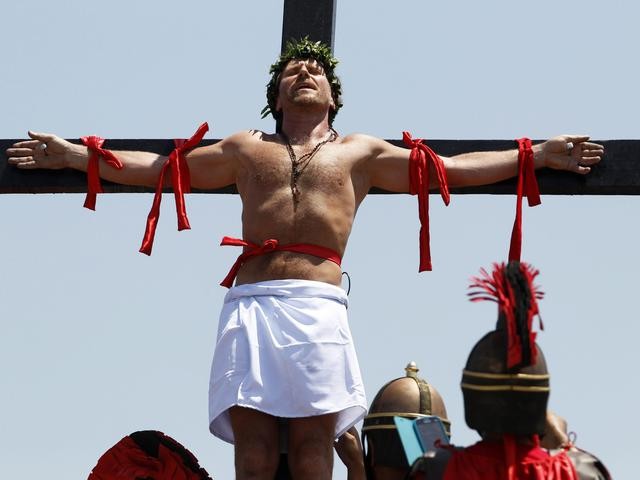 Penitent is nailed to a wooden cross during the re-enactment of the crucifixion of Jesus Christ on Good Friday.